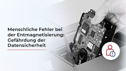 Das Bild zeigt eine Festplatte, die mit bloßen Händen in einen Schredder gesteckt wird, und verdeutlicht das Risiko, das dies für die Umwelt und das menschliche Leben darstellen kann.